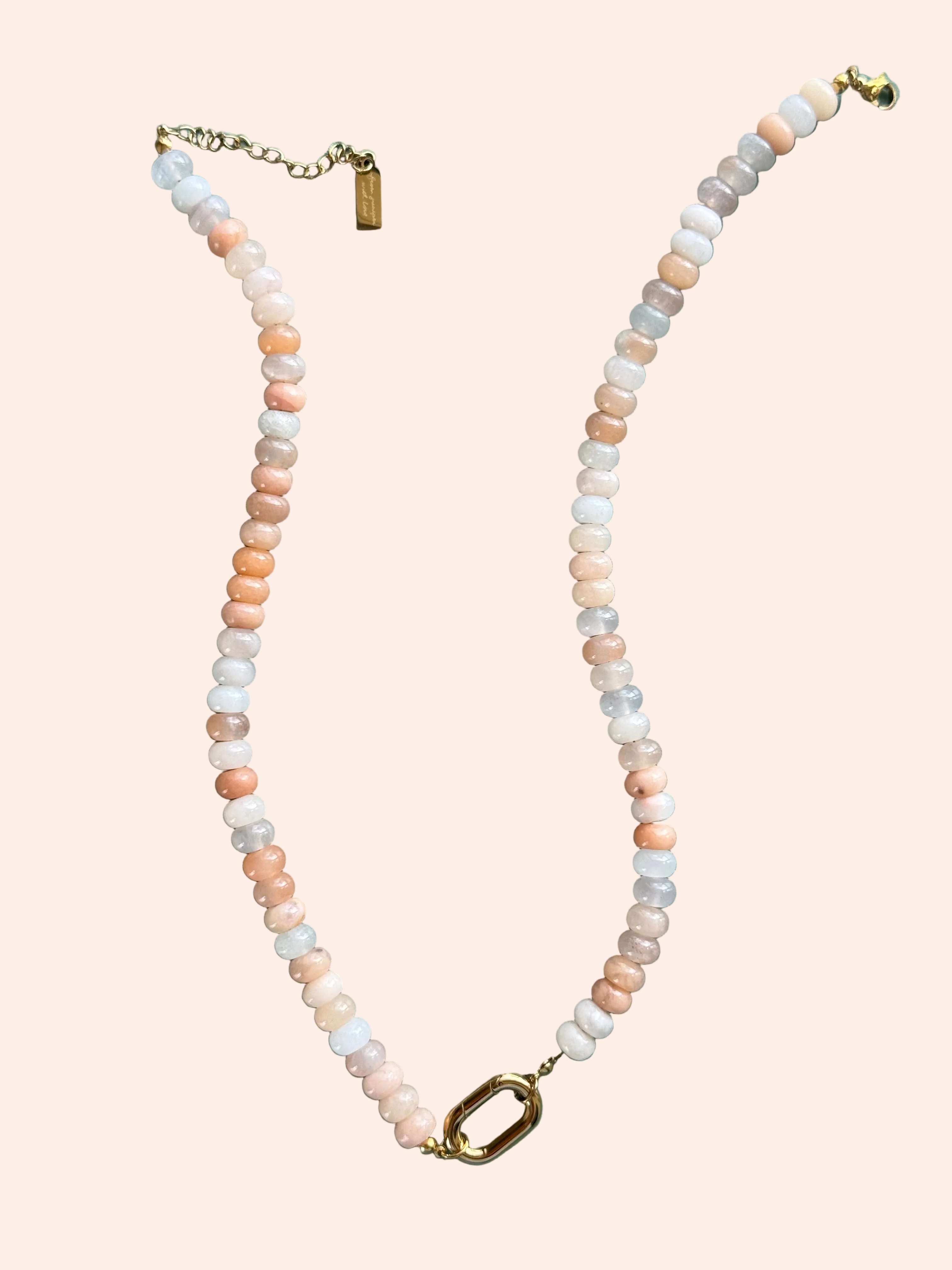 Keepsake Strand Necklace by From Juniper With Love in peach and ivory beads with a gold clasp.