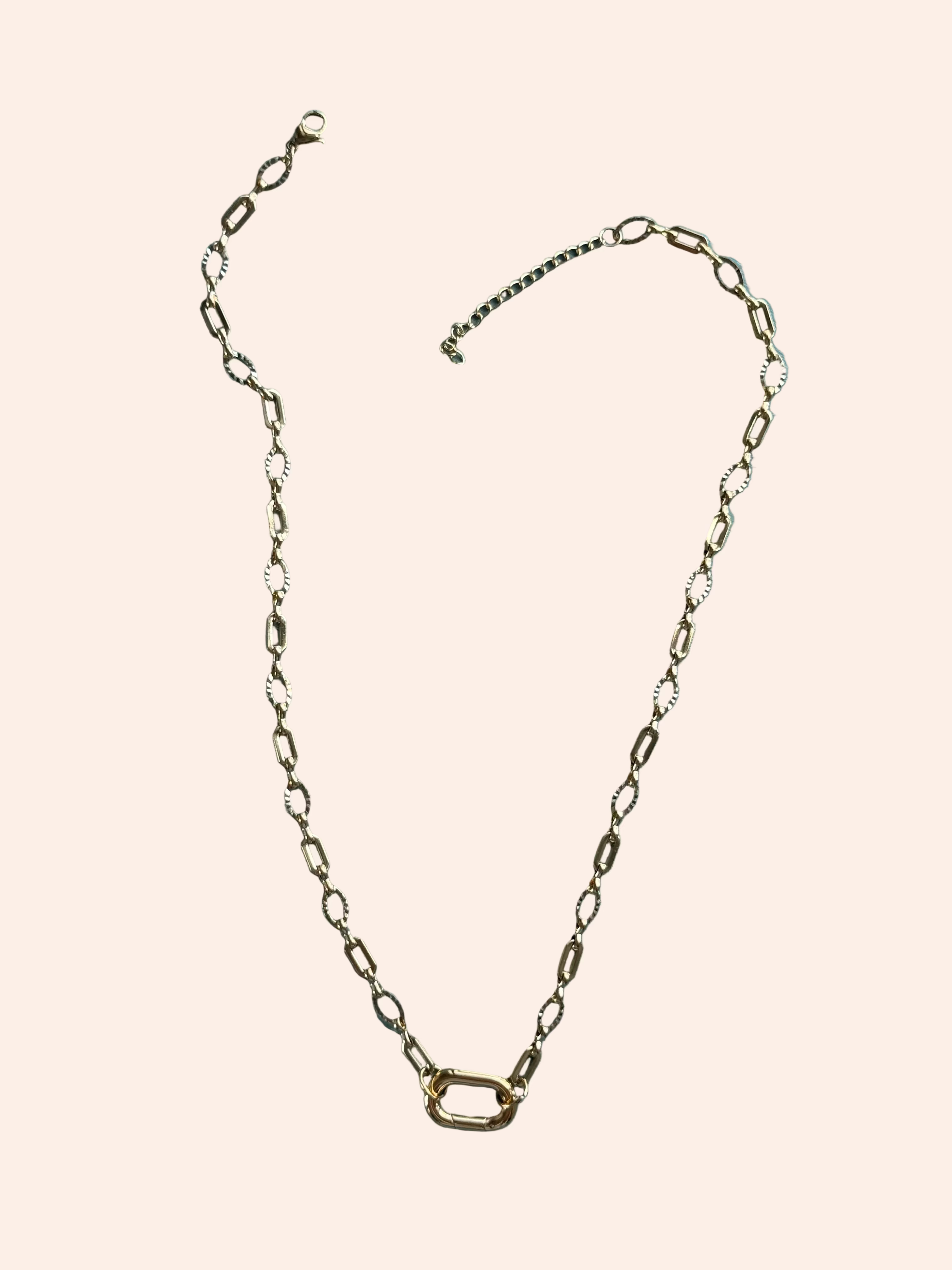 Signature Chain / Sculpted Link necklace in gold-tone metal with elongated rectangular links.