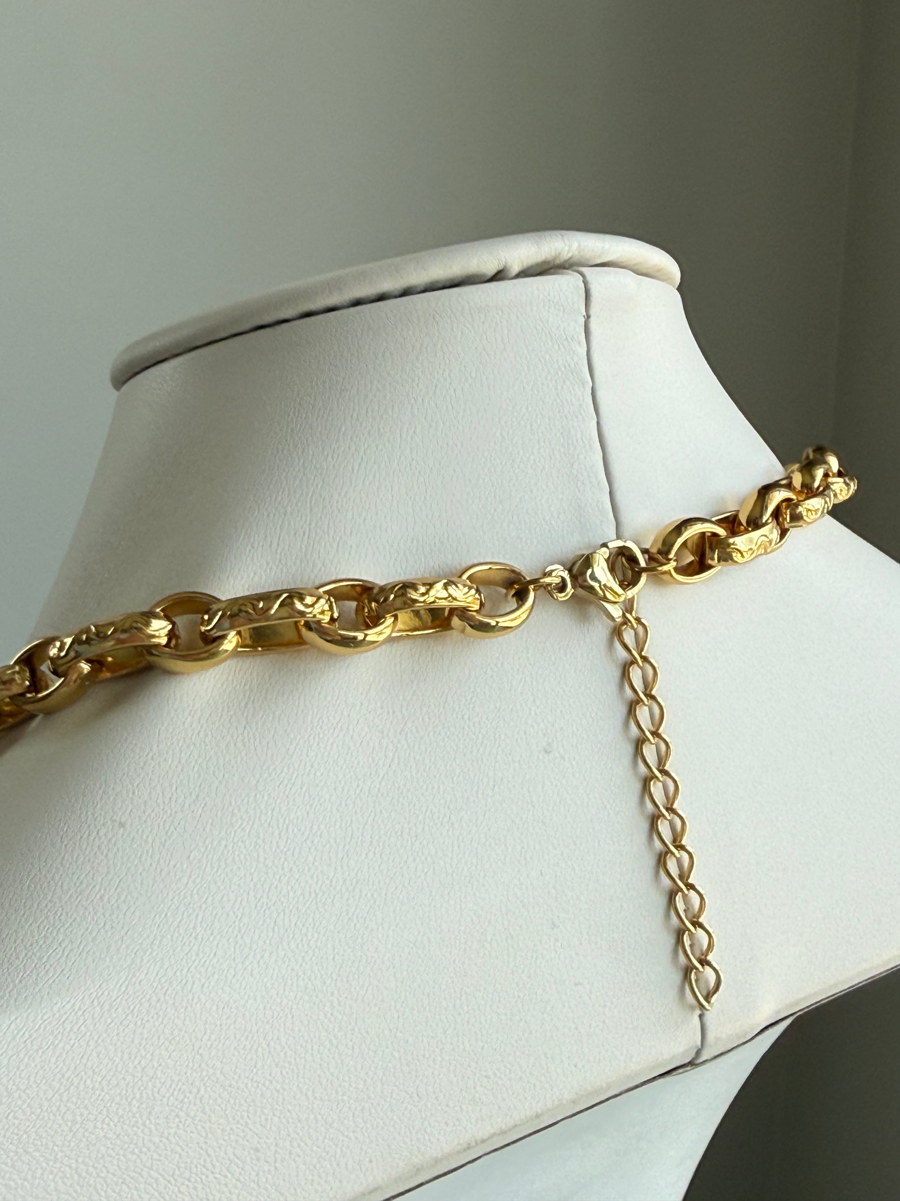 Signature Chain Heirloom Link necklace, gold-tone chunky curb-link chain on display