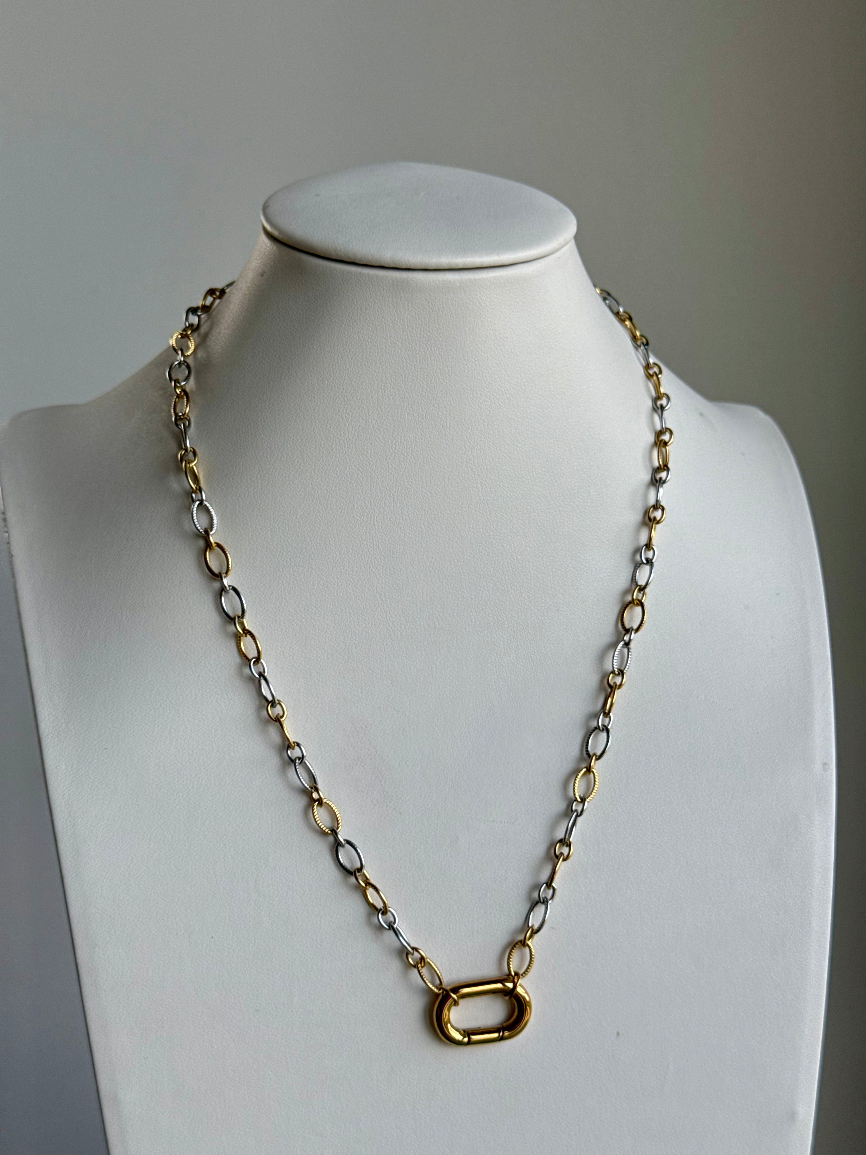 Signature Chain / Mixed Metal Muse necklace with two-tone gold and silver links on display