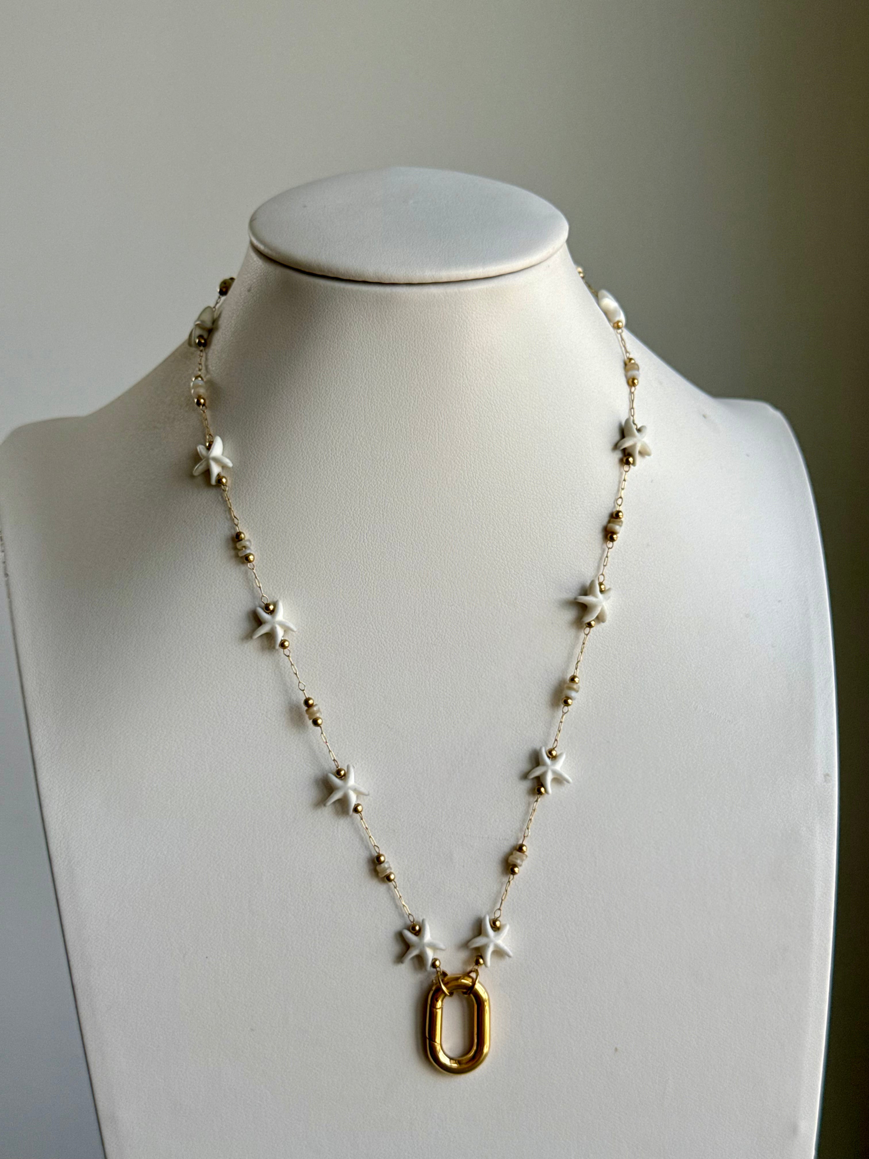 Signature Chain Starfall necklace by From Juniper With Love featuring white star charms and gold beads on a fine chain