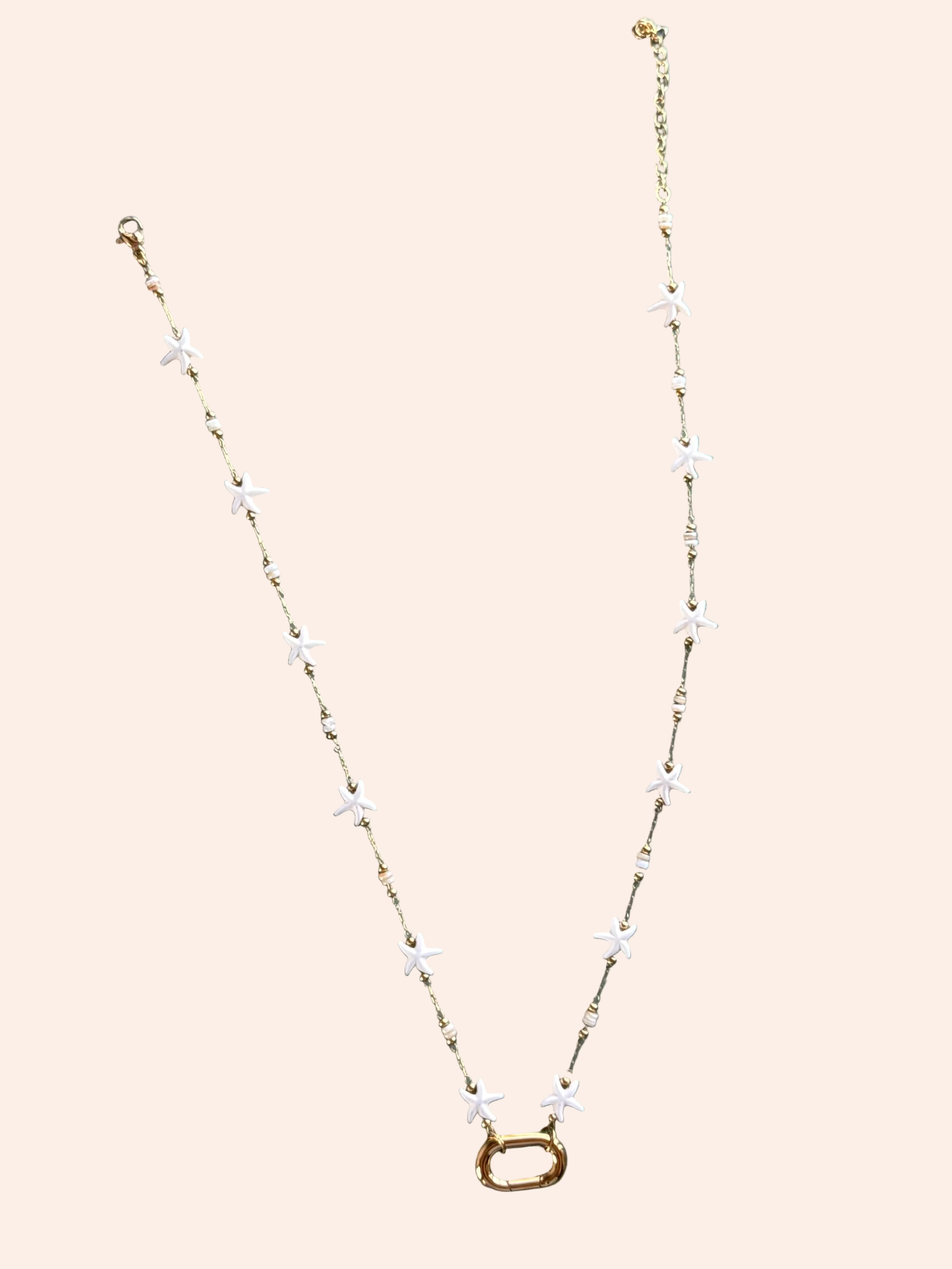 Signature Chain / Starfall Necklace by From Juniper With Love; gold-tone chain with white star charms.