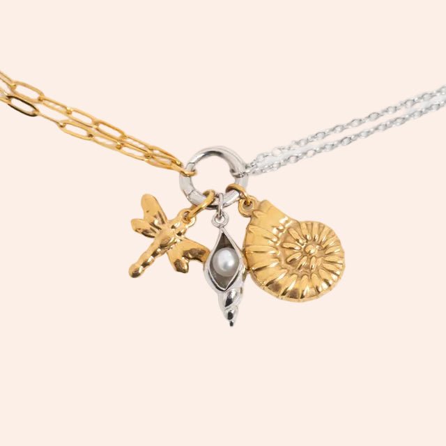 Charm Holder Necklace in gold and silver mix with three charms: butterfly, pearl drop, ammonite charm.