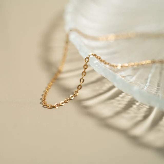 Crimped Oval Link Chain Necklace in gold-tone metal.