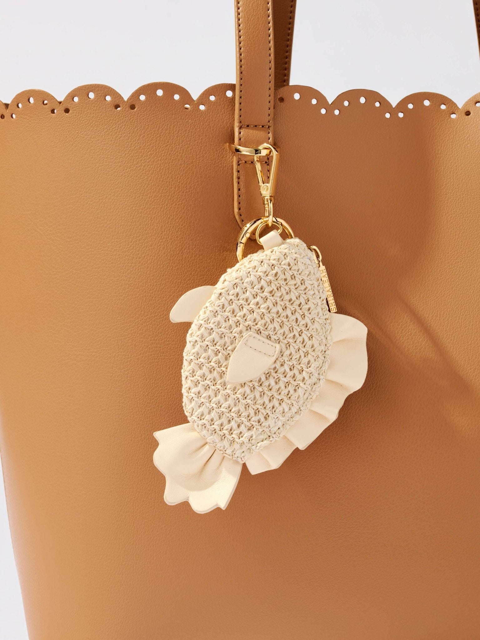 Fish zip pouch charm/key ring by Shiraleah, ivory crochet body with cream fabric fins on tan tote