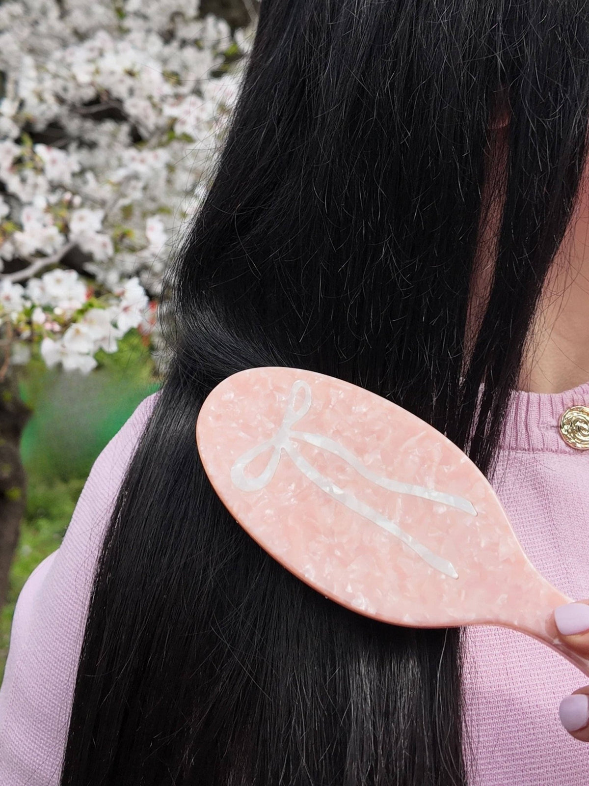 Hand-painted ballet bow hair brush in pink marble with a white bow design, eco-friendly