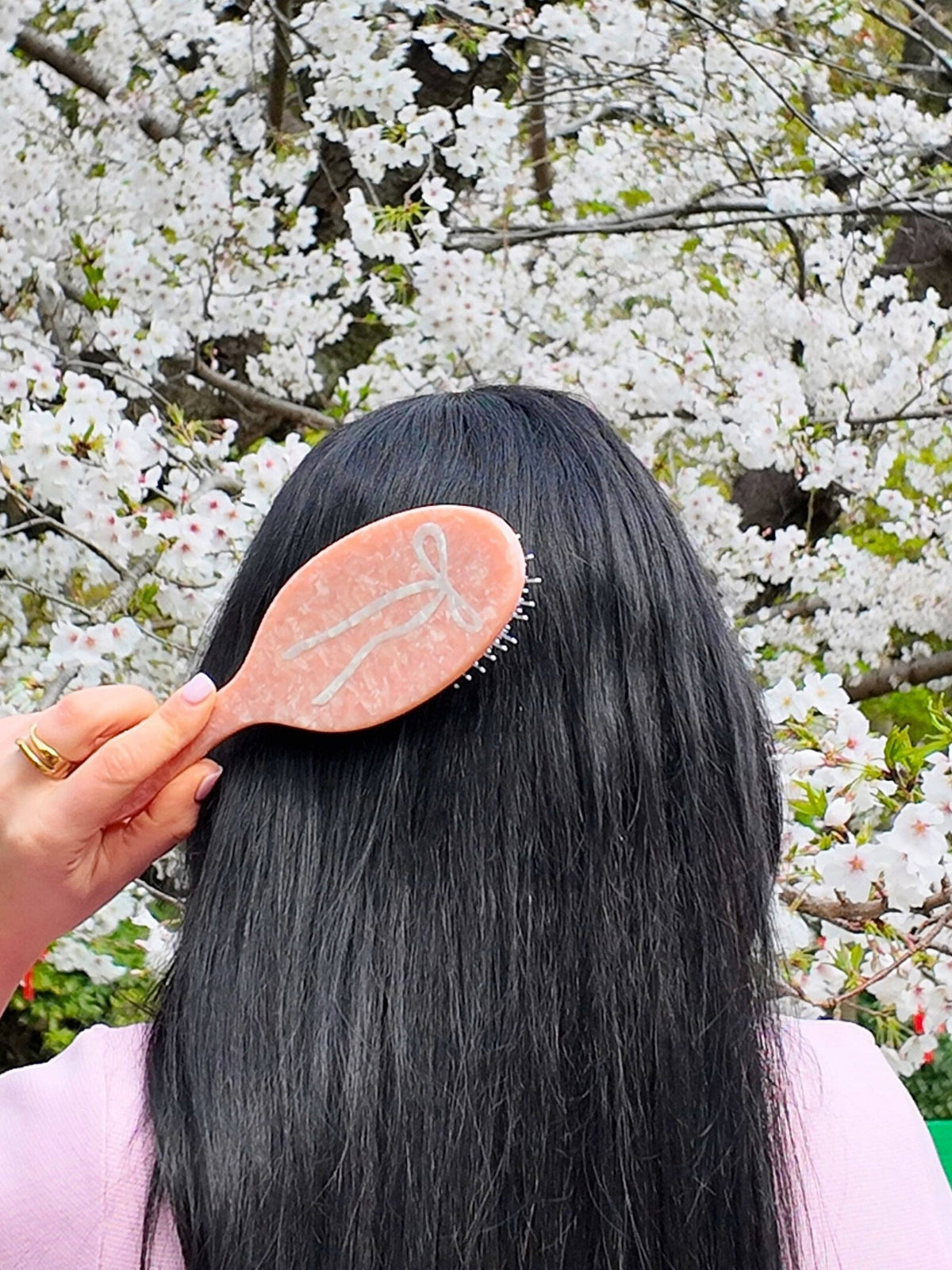 Solar Eclipse Hand-painted Ballet Bow Hair Brush; pink eco-friendly design with a white bow.