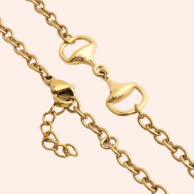 Horse Bit Bracelet in gold tone with chain links and lobster clasps.