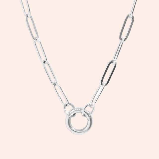 Paperclip charm holder necklace, silver metal with a circular ring centerpiece.