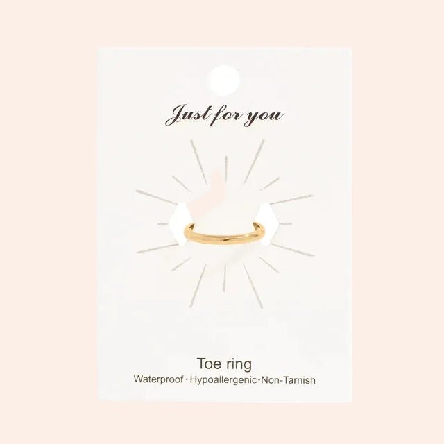 Toe ring by From Juniper With Love, gold-tone metal on a white display card
