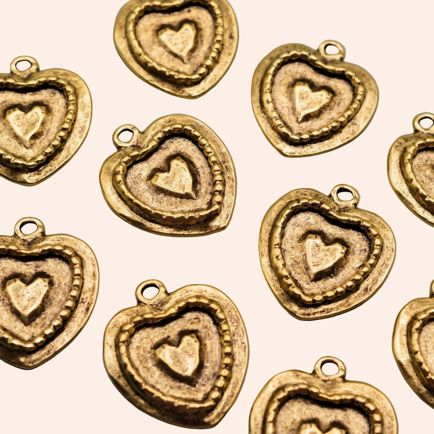 Golden Devotion Heart Charmie Bar charms, gold-tone with textured inner heart detail.