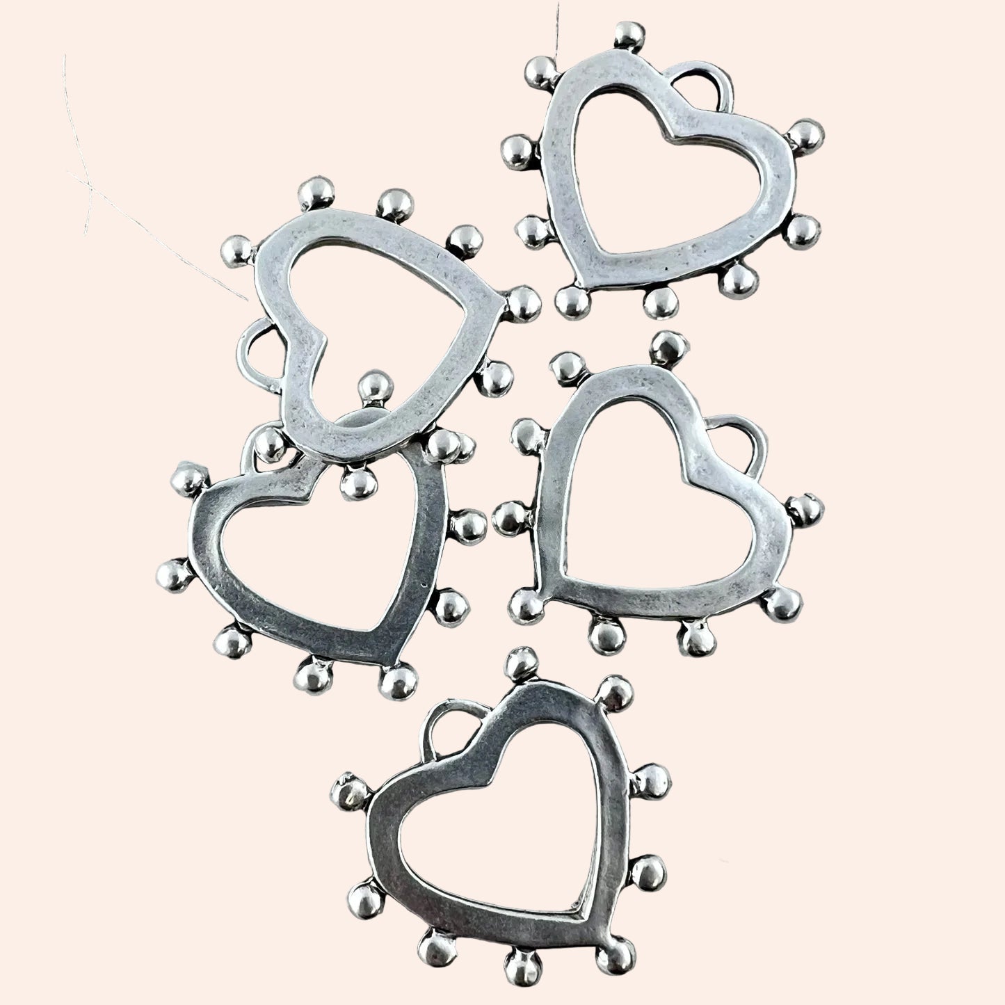 Silver dotted-edge heart Charmie Bar charms, metal heart frames in a cluster