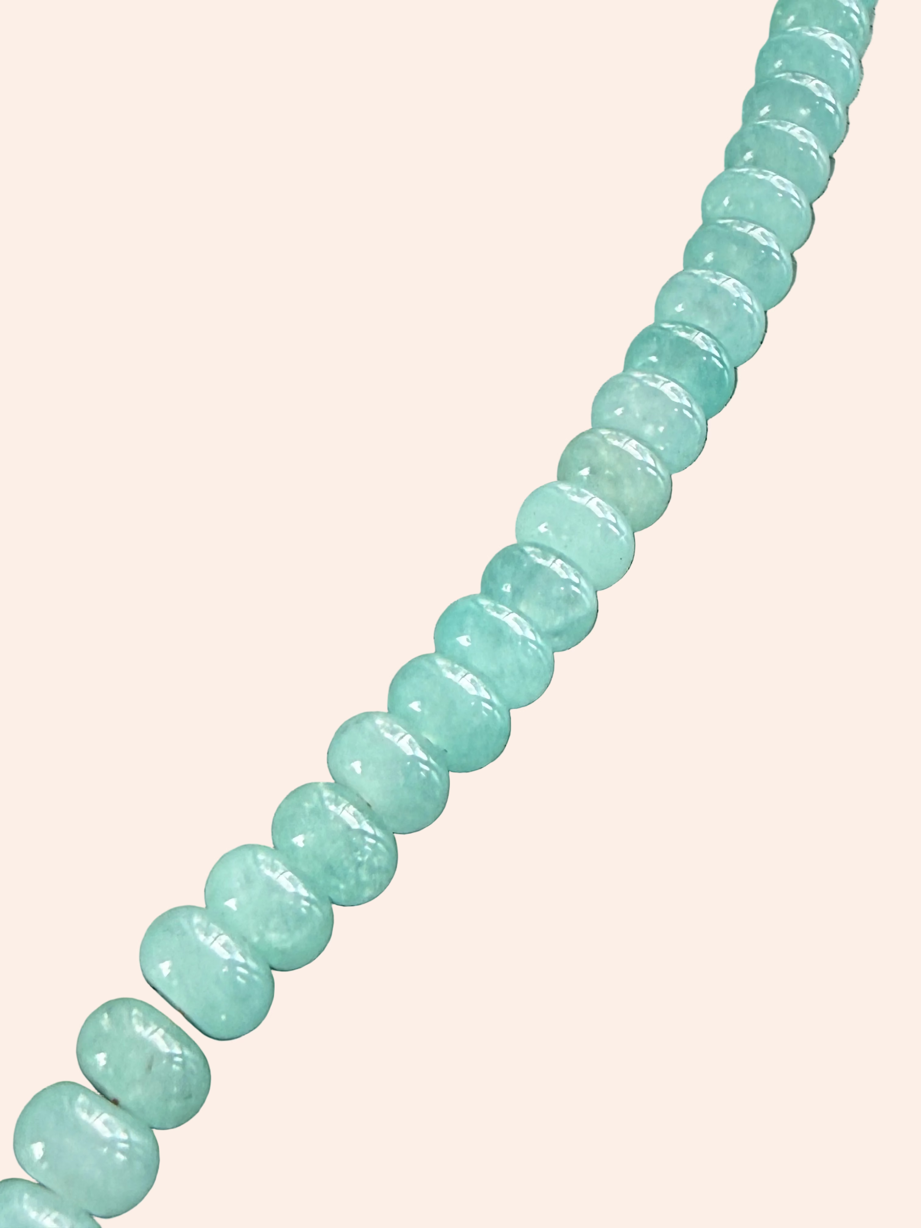 Keepsake Strand Necklace featuring sea glass beads in soft turquoise, shown as a long diagonal strand.