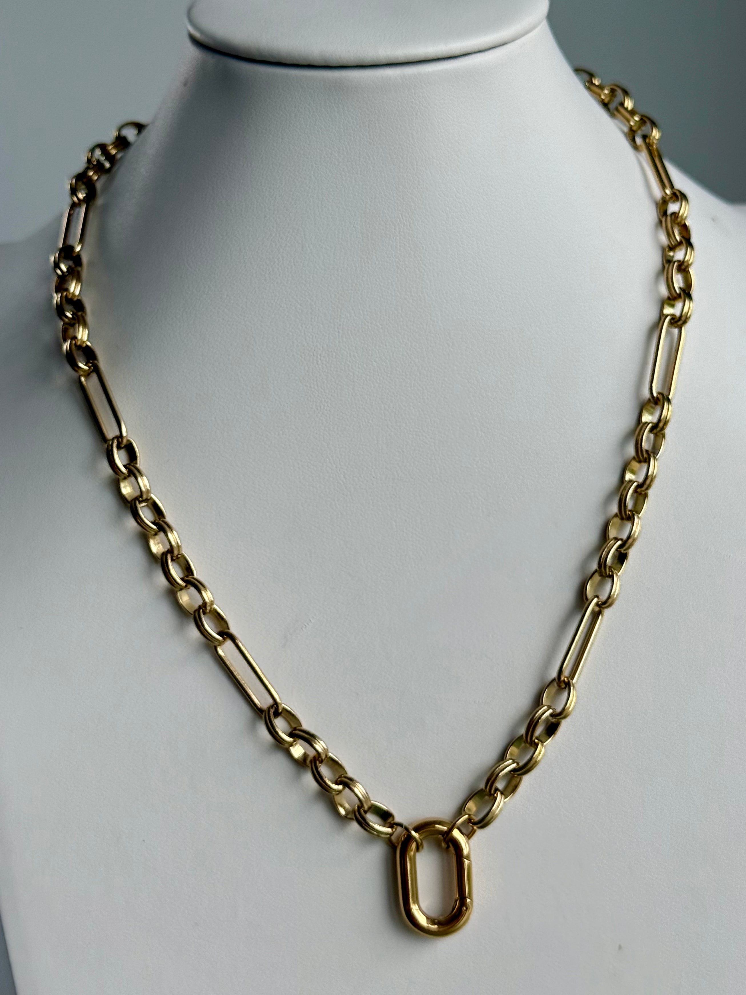 Signature Chain / Modern Keepsake necklace in gold-tone metal with bold rectangular links and a central U-shaped pendant.