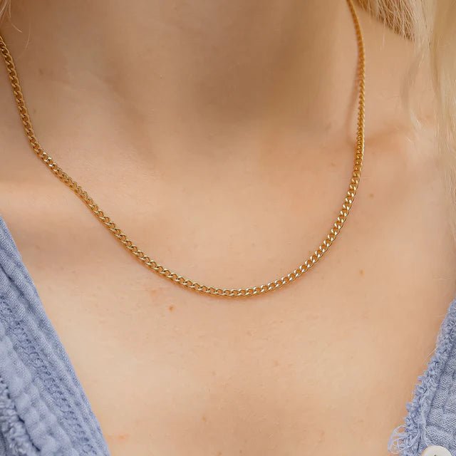 Necklace: gold curb chain by From Juniper With Love, a classic gold-tone accessory.