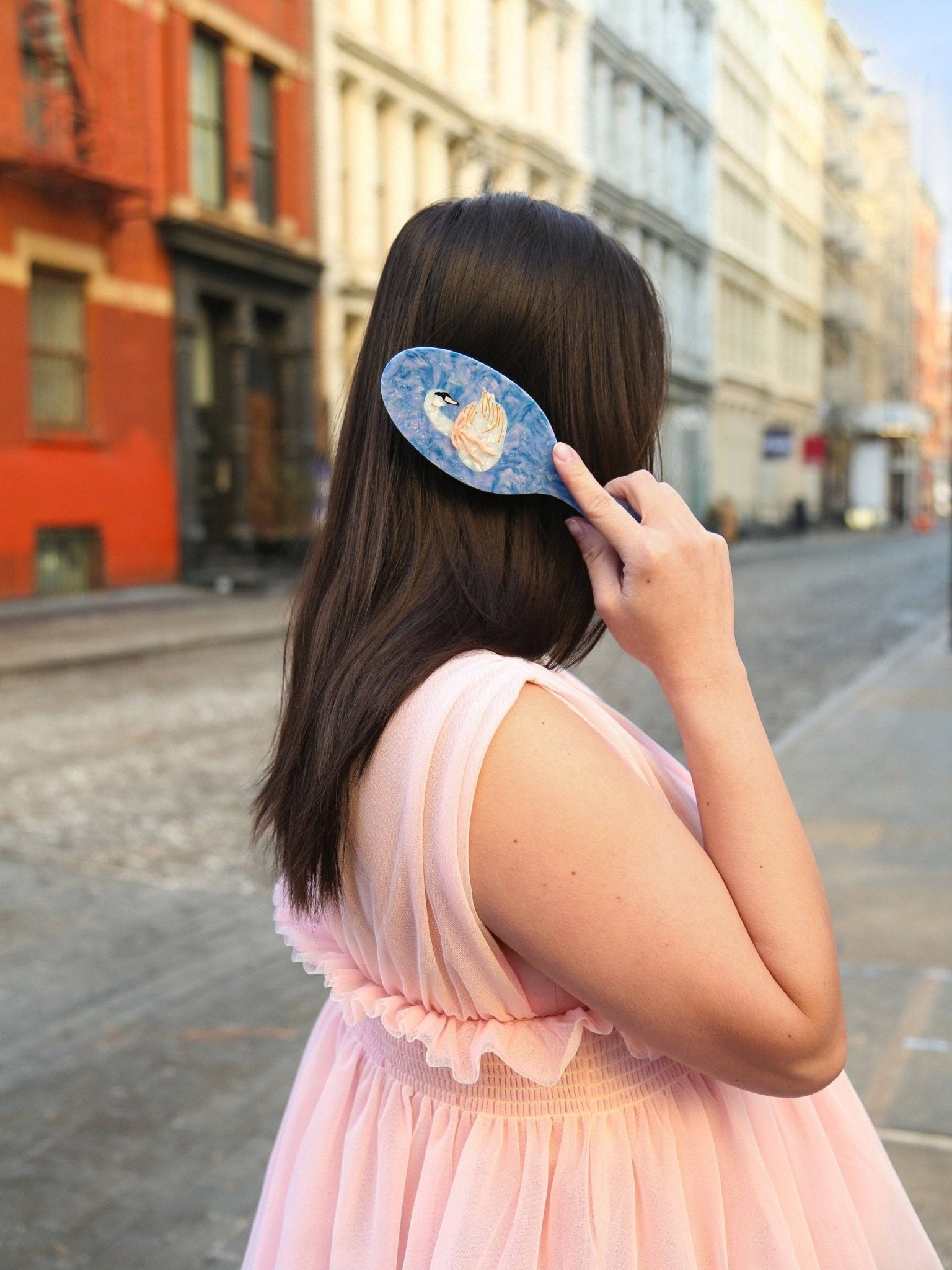 Hand-Painted Bow Swan hair brush by Solar Eclipse; blue marbled background with swan motif
