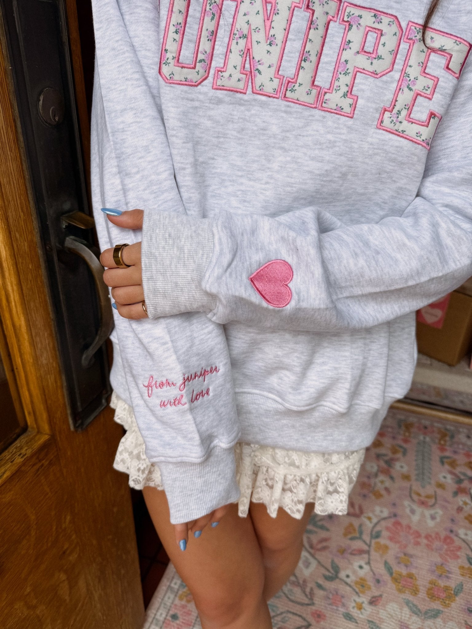 Juniper Collegiate Mock Neck sweatshirt in heather gray with pink floral JUNIPER lettering and heart patch