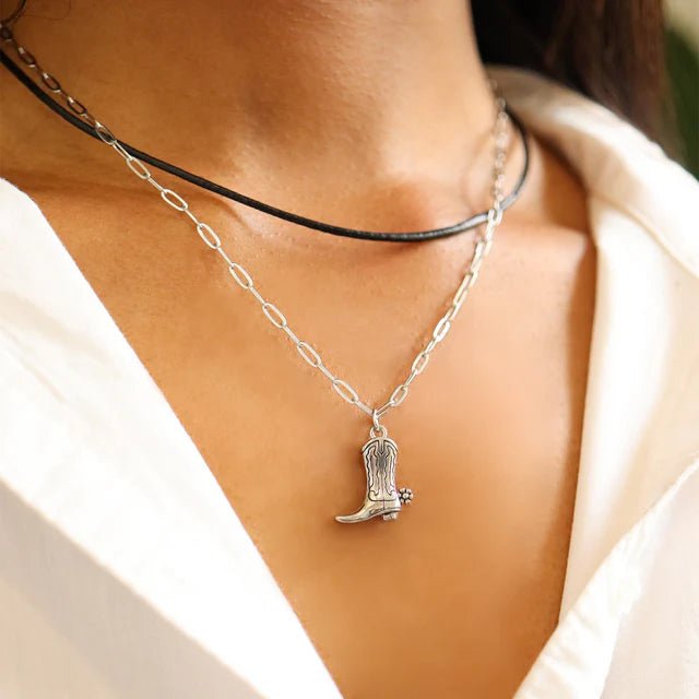 Necklace: silver paperclip chain 2.5mm with boot pendant, shown layered with a black choker