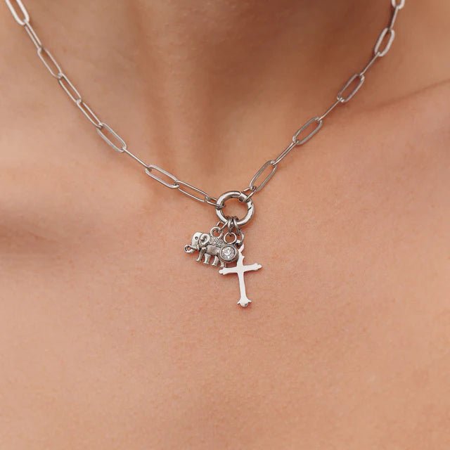 From Juniper With Love paperclip charm holder necklace, silver finish with elephant and cross charms.
